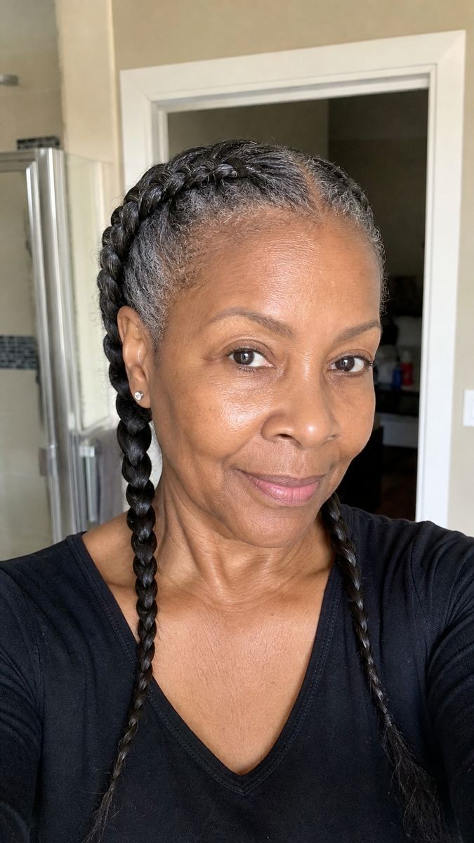 classic French braids on a Black woman over 50