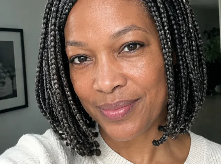 Older Black woman with chin-length box braids and a neat lightweight finish