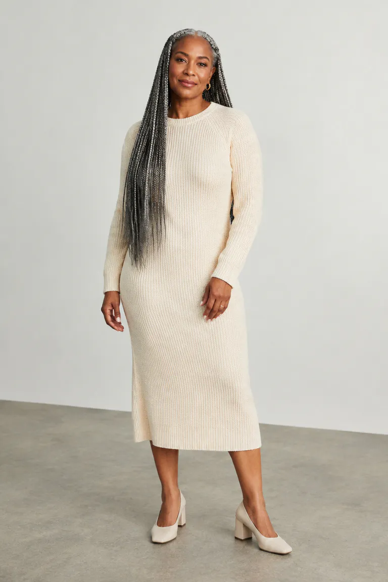 Black woman over 50 wearing loose waist-length gray box braids with medium parts and soft edges