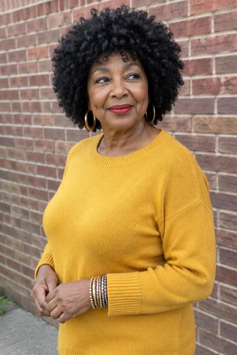 Rounded soft Afro-curl crochet style in black