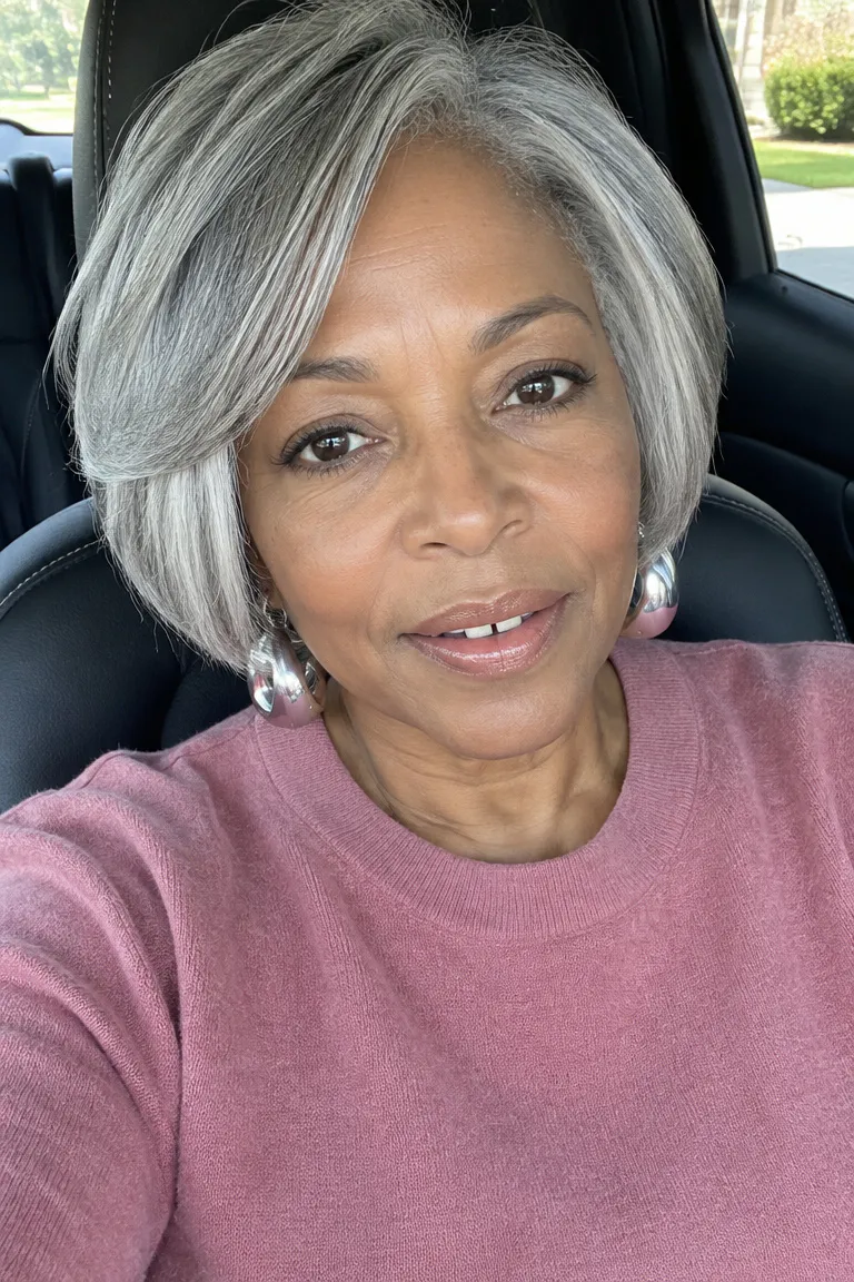 Short gray shaped bob with a clean outline and subtle face framing